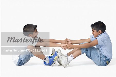 Side profile of two boys playing together