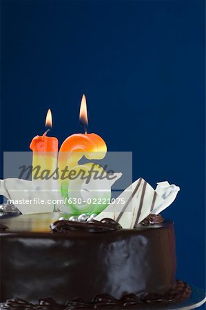 Close-up of lit candles on a birthday cake
