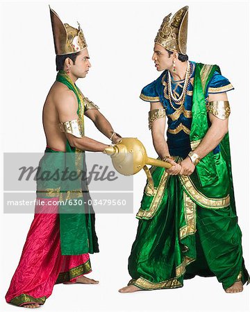 Two young men fighting in the character of Hindu epic