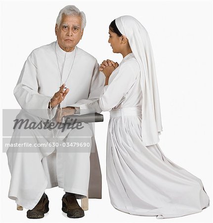 Nun confessing her sins to a priest