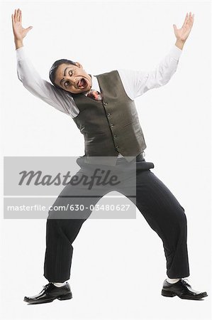 Businessman with his arms raised