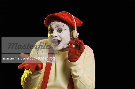 Portrait of a mime wearing headset