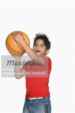 Boy throwing a basketball