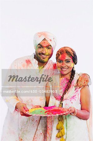 Portrait of a couple celebrating Holi