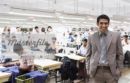 Portrait of a businessman in a textile factory