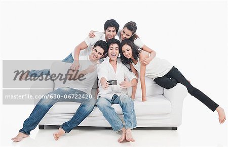 Friends taking picture of themselves with a mobile phone