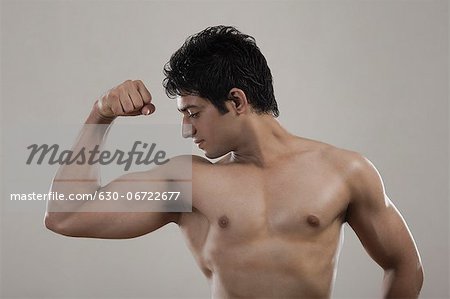 Premium Photo  Bodybuilder bodybuilding flexing chest muscles