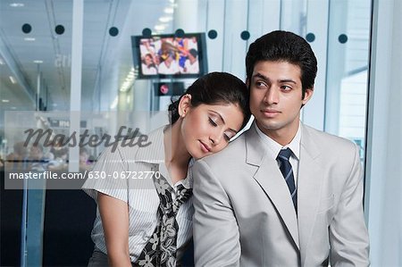 Business couple at an airport lounge