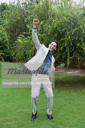 Businessman dancing in the rain