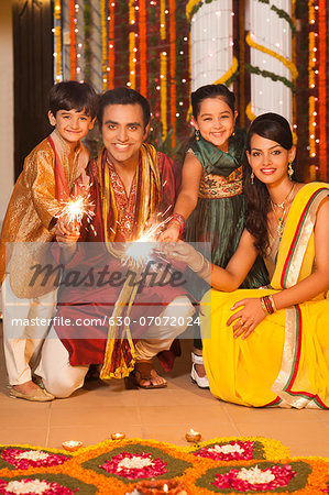 Family burning fire crackers on Diwali