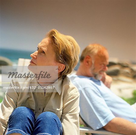 Mature couple sitting outside