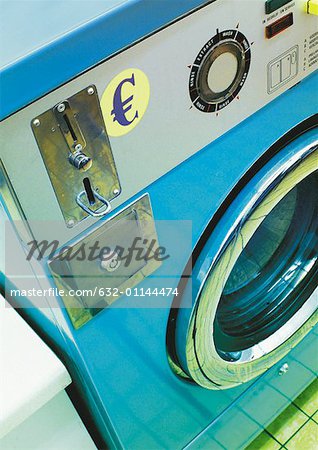 Euro sign on public washing machine.