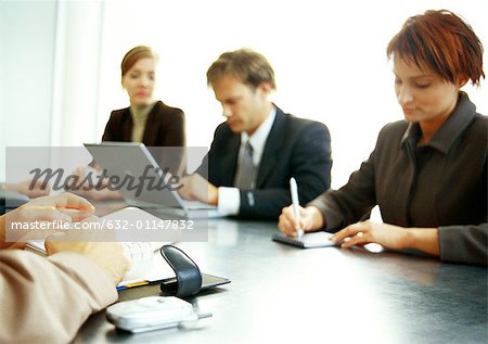 Business people working together at table