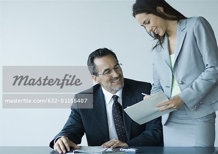 Business colleagues working together, smiling