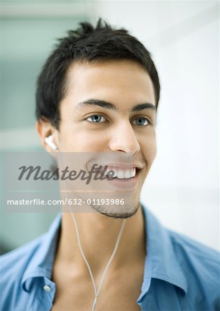 Teen boy listening to earphones