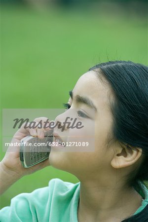 Girl using cell phone, close-up
