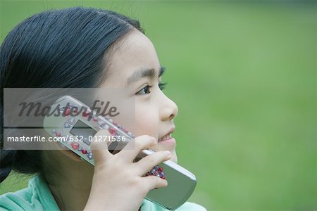Little girl using cell phone, close-up