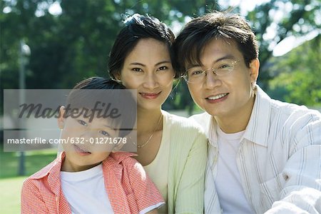 Family, smiling at camera, portrait