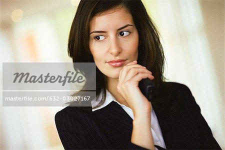 Businesswoman looking away in thought, portrait