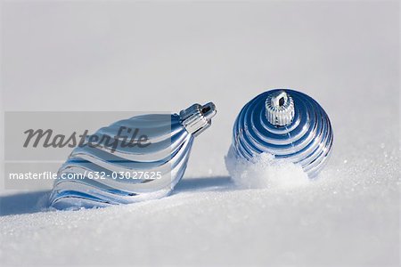 Christmas ornaments on snow