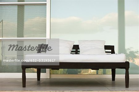 Bed on outdoor patio at resort