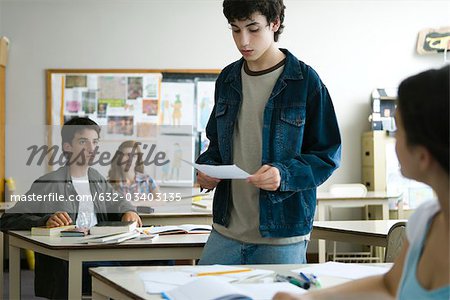 High school student giving presentation in class