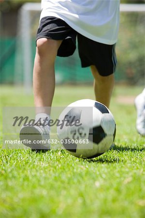 Child playing soccer, cropped Child playing soccer, cropped