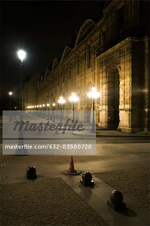 France, Paris, exterior of The Louvre illuminated at night