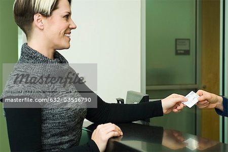 Woman showing medical insurance card