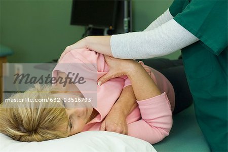 Woman being treated by physical therapist