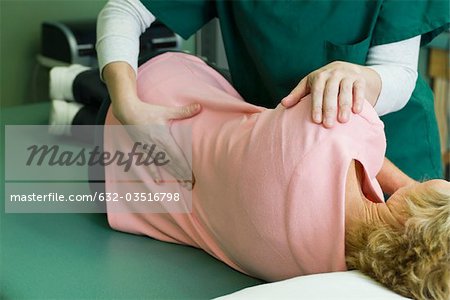 Woman being treated by physical therapist