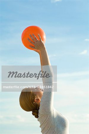 Woman stretching with fitness ball