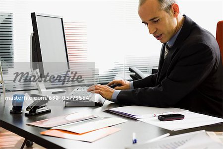 Executive using desktop computer