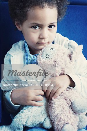 Little girl hold stuffed toys, portrait