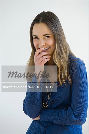 Young woman laughing, portrait