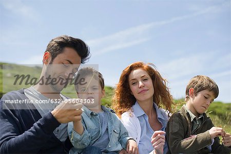 Parents and young boys in nature