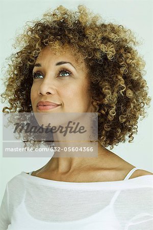 Woman looking up optimistically, portrait