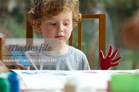 Little boy finger painting