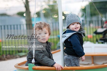 Toddler boys playing on playground