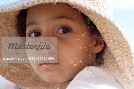 Little girl wearing sun hat, portrait