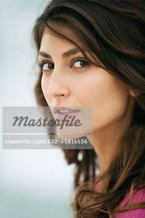 Woman glancing sideways at camera, portrait