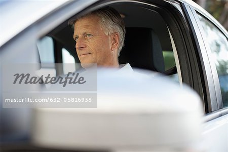 Man driving car, cropped