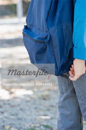 Boy with backpack, mid section