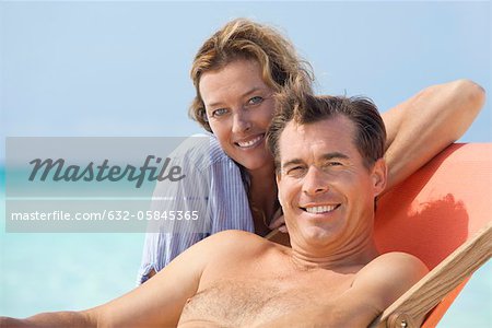 Couple spending time at beach, portrait