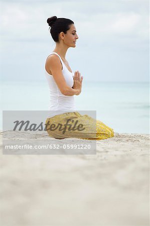 Man And Woman Kneeling Hands In Prayer Position Above Head High-Res Stock  Photo - Getty Images