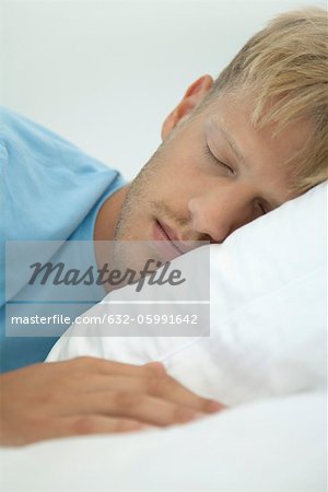 Young man sleeping, cropped