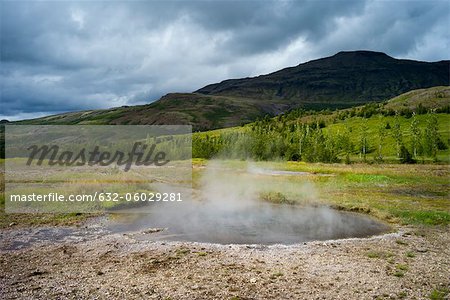 Steam rising from volcanic hot spring, Iceland