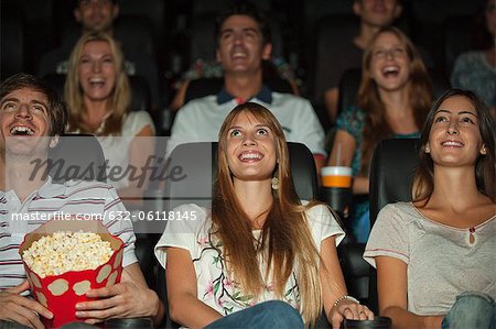Audience watching movie in theater