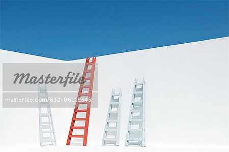 Ladders leaning against wall