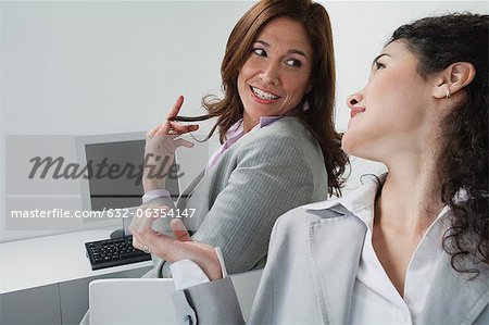 Women chatting in office